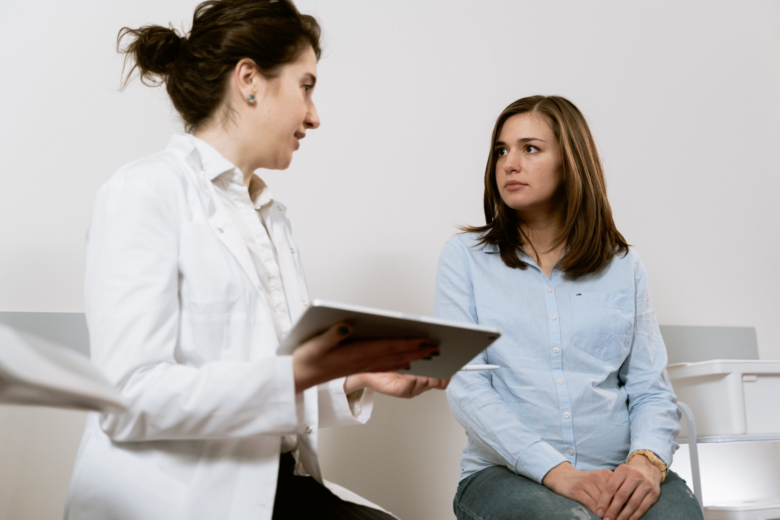 Female patient being consulted by a doctor
