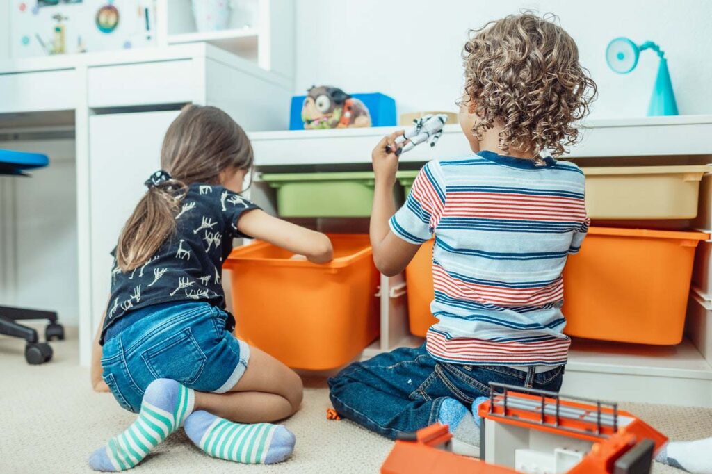 Young boy and girl playing with toys together